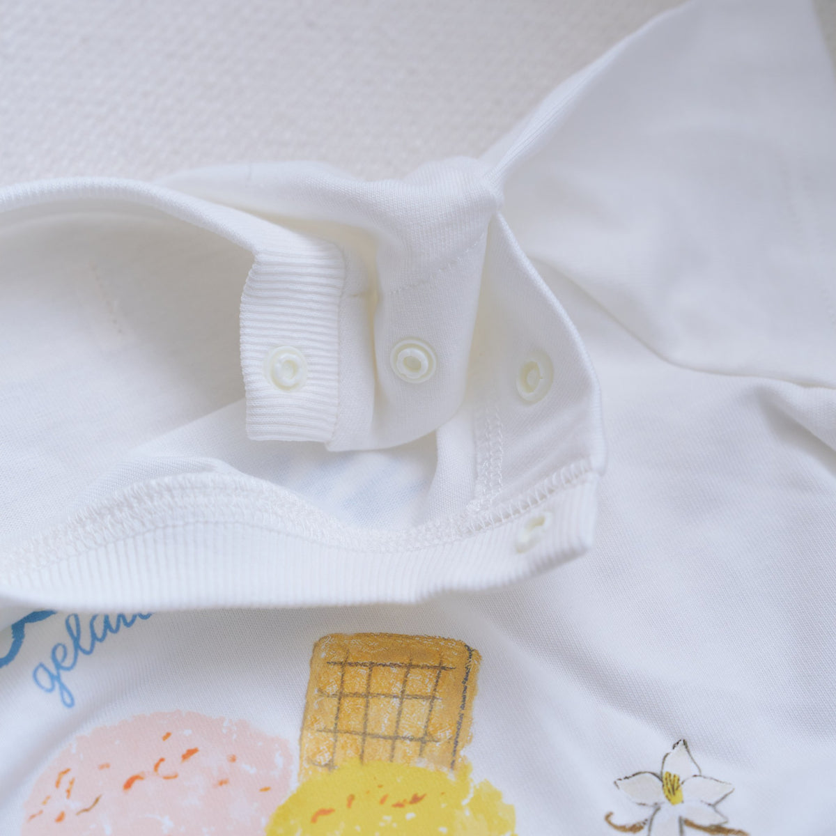 Shoulder snap detail on Creamy Gelato Romper
