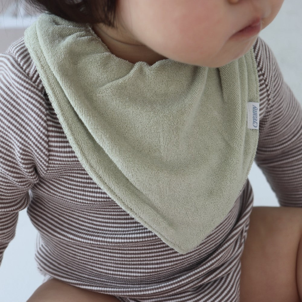 Baby wearing Creamy Gelato Bib in Pistachio