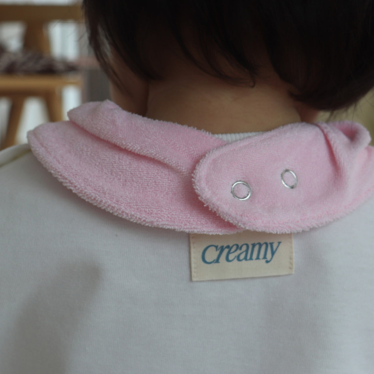 Back snap closure of Creamy Gelato Bib